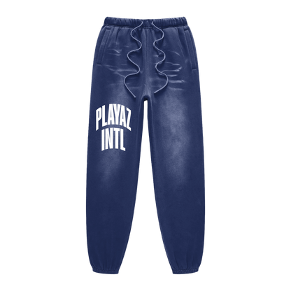 Blue sweatpants with 'PLAYAZ INTL' text on a white background