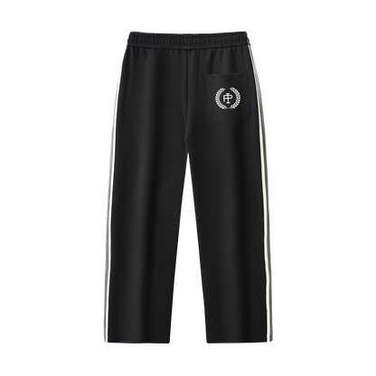 Black track pants with white stripes and logo on a white background